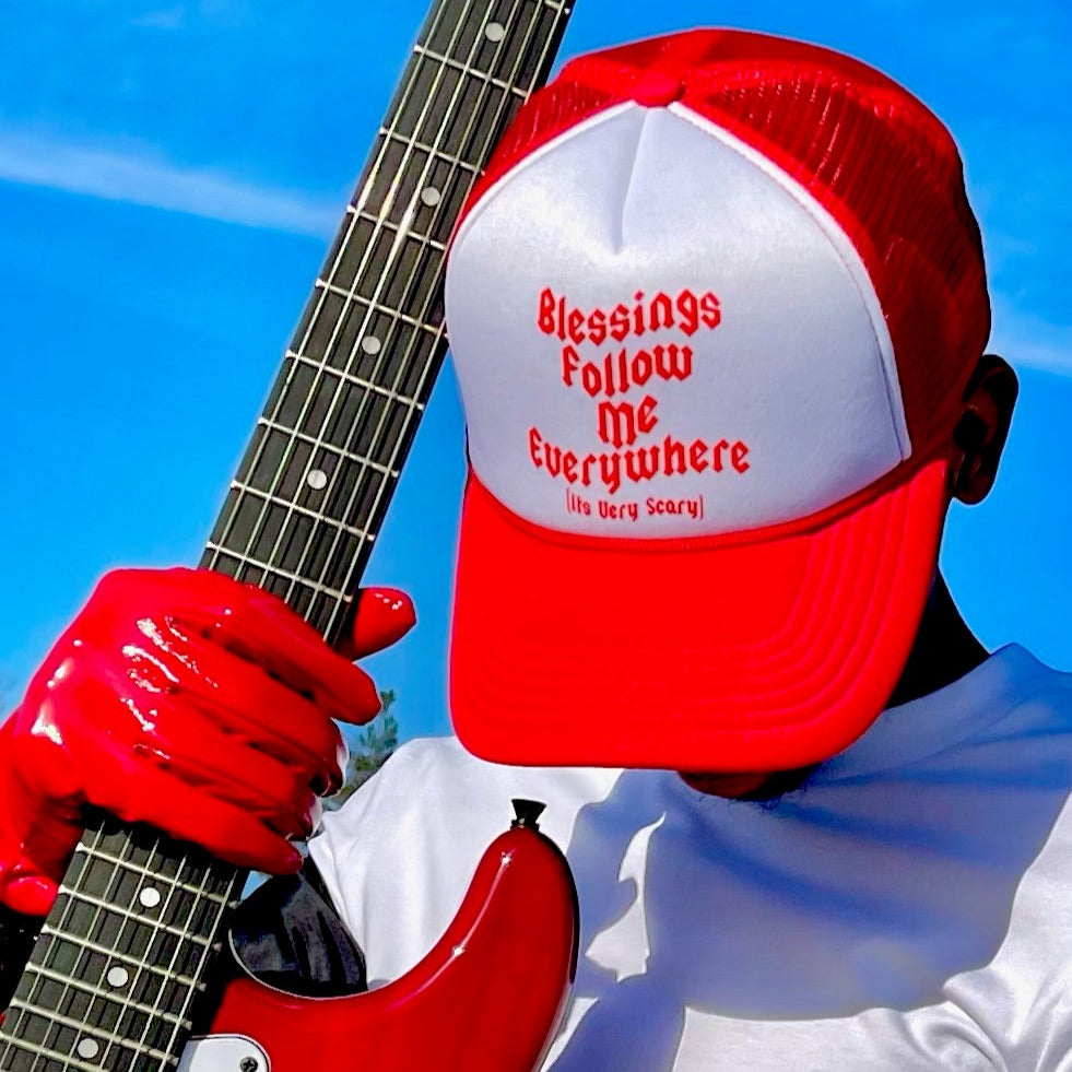 BLESSINGS FOLLOW ME TRUCKER CAP